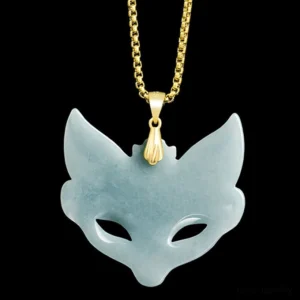 Smooth, uncarved light cyan jade fox mask pendant, showcasing minimalist design with polished gold-toned titanium steel bail and chain