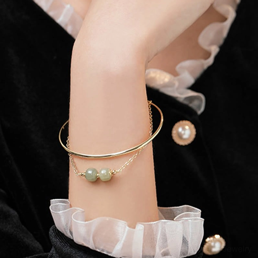 Gold plated jade bangle bracelet with premium buckle closure detail and handcrafted hetian jade beads