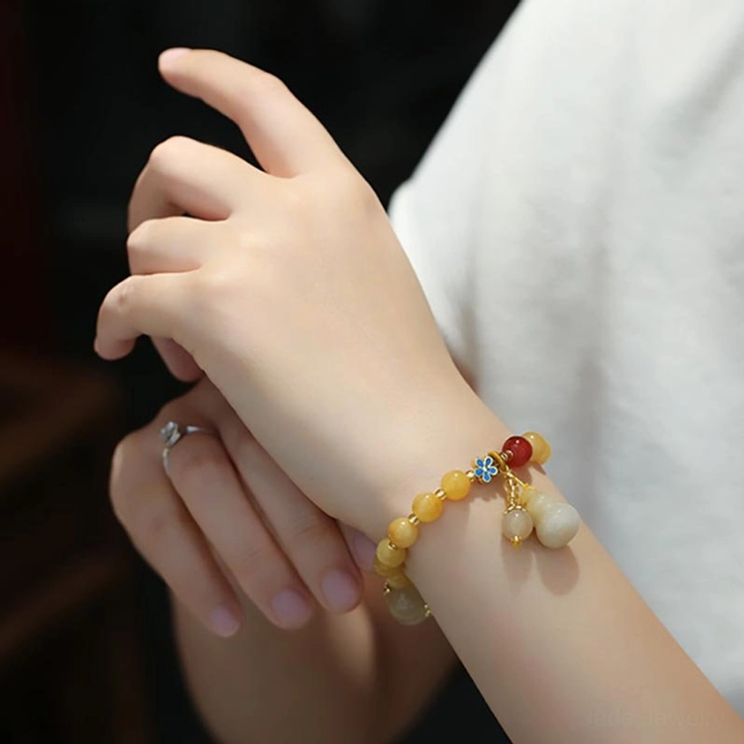 Golden Silk Jade Gourd Bracelet Worn on Wrist - Right Side View Showing Full Charm Design