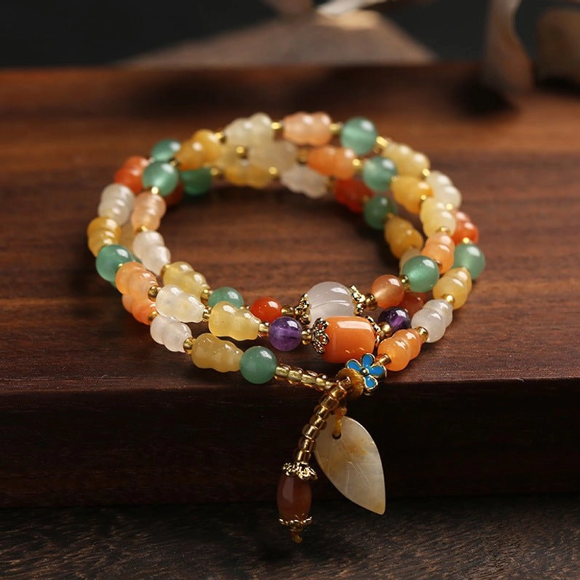 Golden Silk Jade Gourd Bracelet - Double-wrap jade beads with gold leaf charm and enamel flower clasp