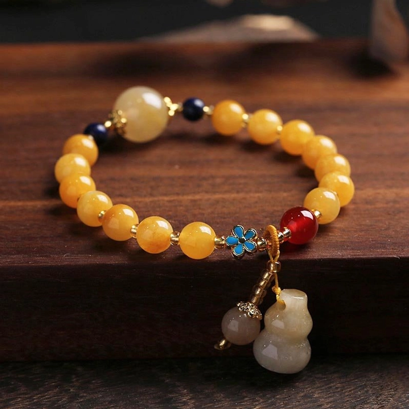 Golden Silk Jade Gourd Wealth Bracelet - Top Down View with Dual Pendants and Enamel Flower Charm