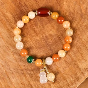 Golden Silk Jade Beaded Bracelet with Dangling Gourd Charms - Tabletop Display