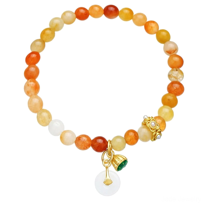 Golden silk jade beaded bracelet with gradient warm jade beads, gold-toned charms, and peace buckle pendant on light background