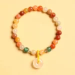 Golden Silk Jade Peace Buckle Beaded Bracelet with 14K Gold Plating - Overhead Flat Lay View