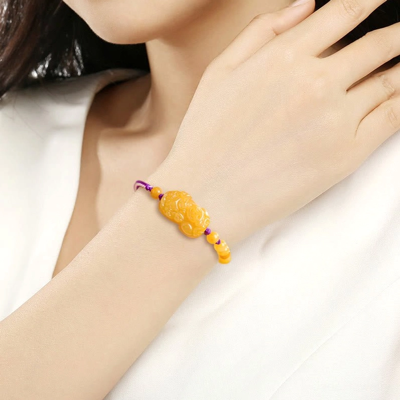 Golden Silk Jade Pi Xiu bracelet detail shot emphasizing natural stone quality and charm craftsmanship