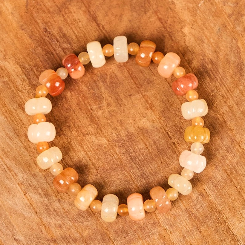 Golden Silk Jade jade pumpkin bracelet full loop strand overhead view displaying warm earthy tone beads on wood