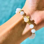 Golden Silk Jade Rabbit Bracelet worn on wrist with jade beads and gold rabbit charm detail