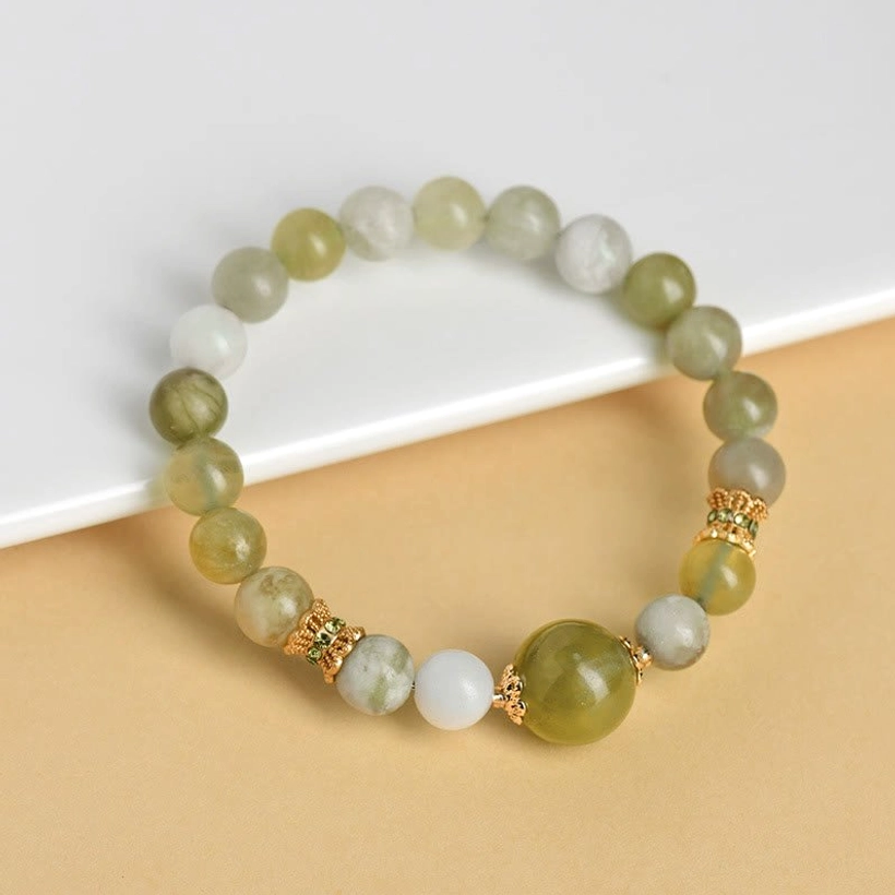 Gradient green jade bracelet with mixed matte and glossy beads and gold spacers