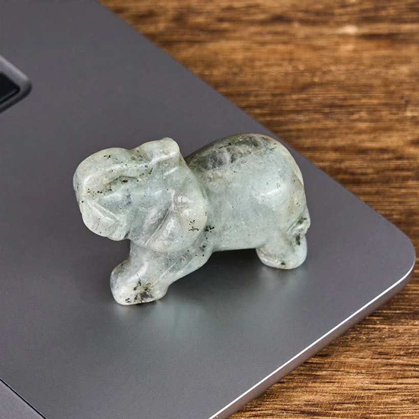 Green aventurine elephant stone figurine attracting luck prosperity and abundance