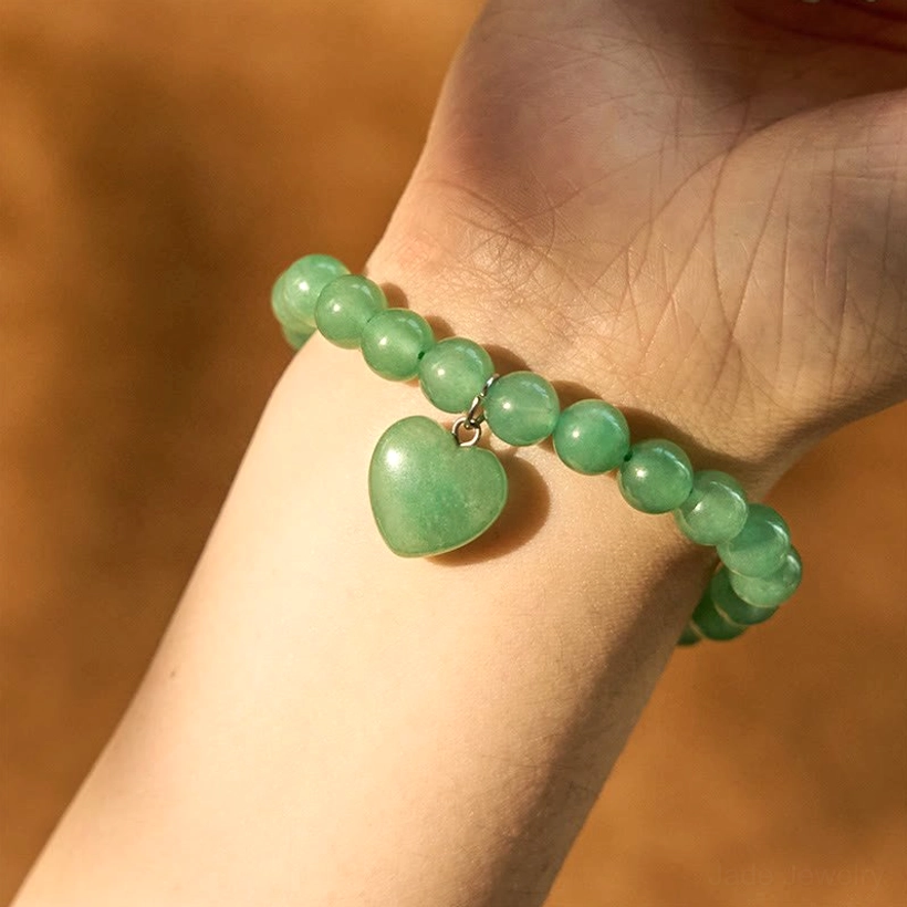 Green Aventurine heart bracelet worn on human wrist showing natural fit and comfort