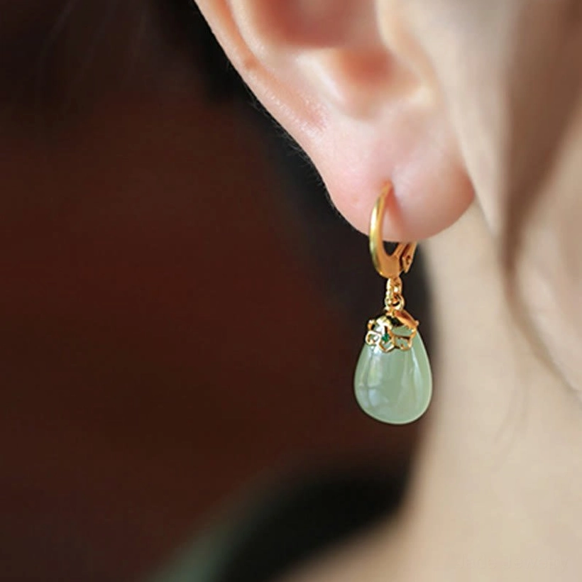 Green chalcedony jade earrings artistic styling photograph showing elegance sophistication gemstone jewelry aesthetic