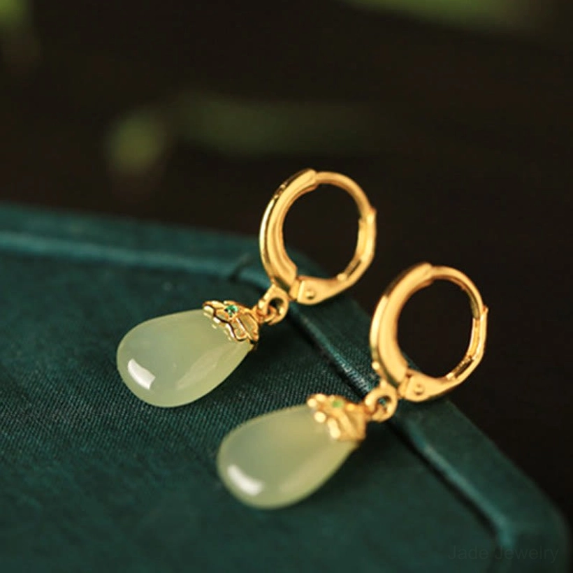 Green chalcedony water drop earrings with copper posts natural gemstone jewelry artisan handmade craftsmanship detail shot