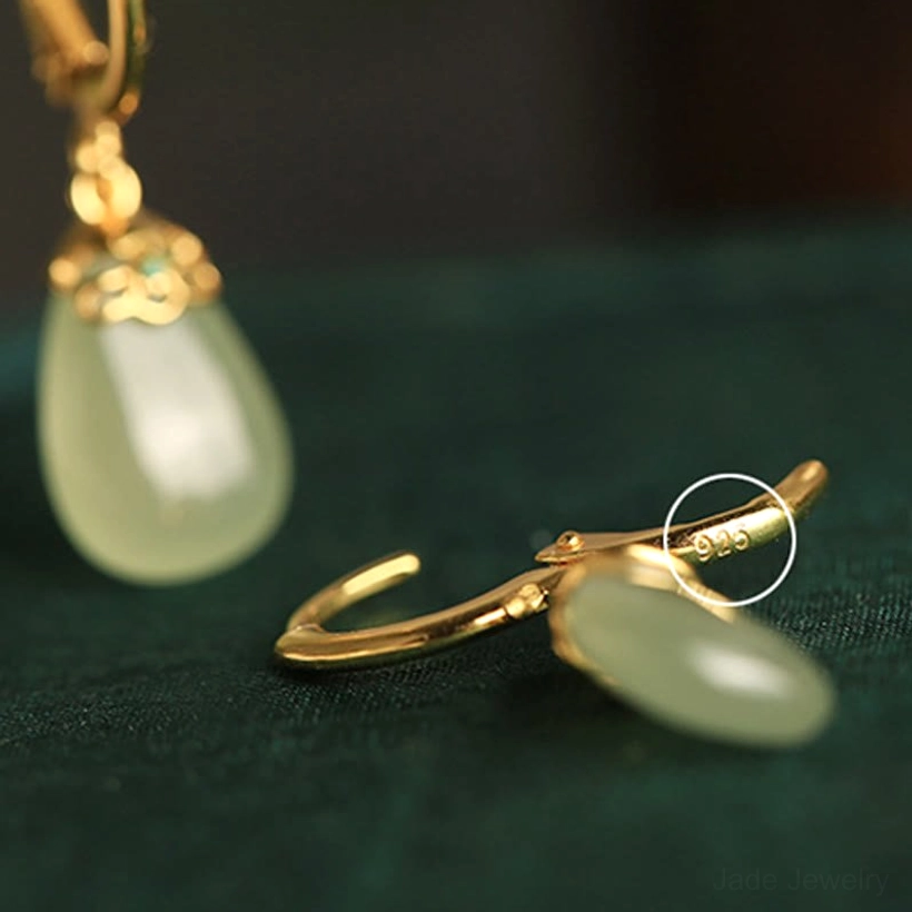 Green chalcedony water drop earrings lifestyle shot showing size proportion on model ear comfort fit copper posts