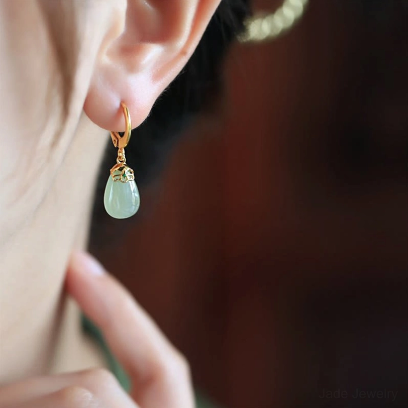 Green chalcedony jade earrings product photography showing complete pair water drop shape artisan quality