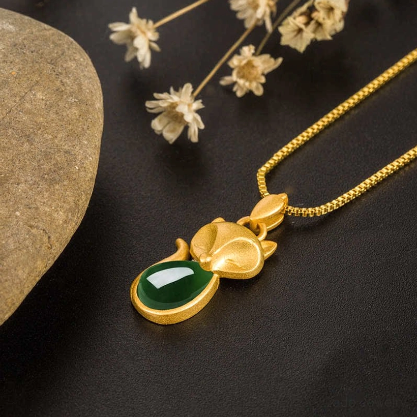 Green chalcedony fox jade necklace - angled top-down view with chain and natural stone styling