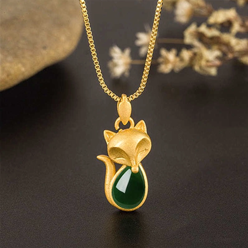 Fox-shaped gold necklace with green chalcedony - hanging pendant front view on dark background