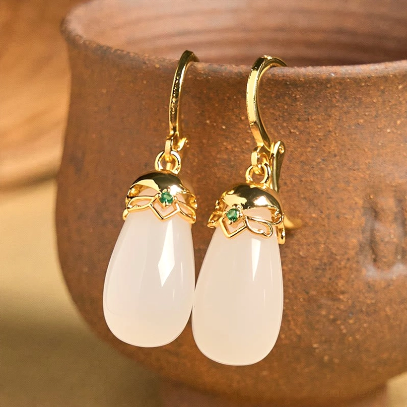 Natural green chalcedony raw stone and water drop earrings product information page showing strength and courage stone benefits metaphysical properties