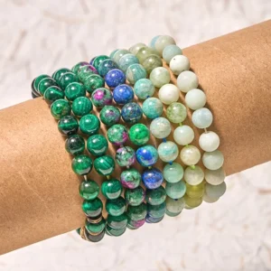 Green harmony jade amazonite balance bracelet worn on wrist, close-up side view showing mixed gemstone beads in green, blue, and earth tones