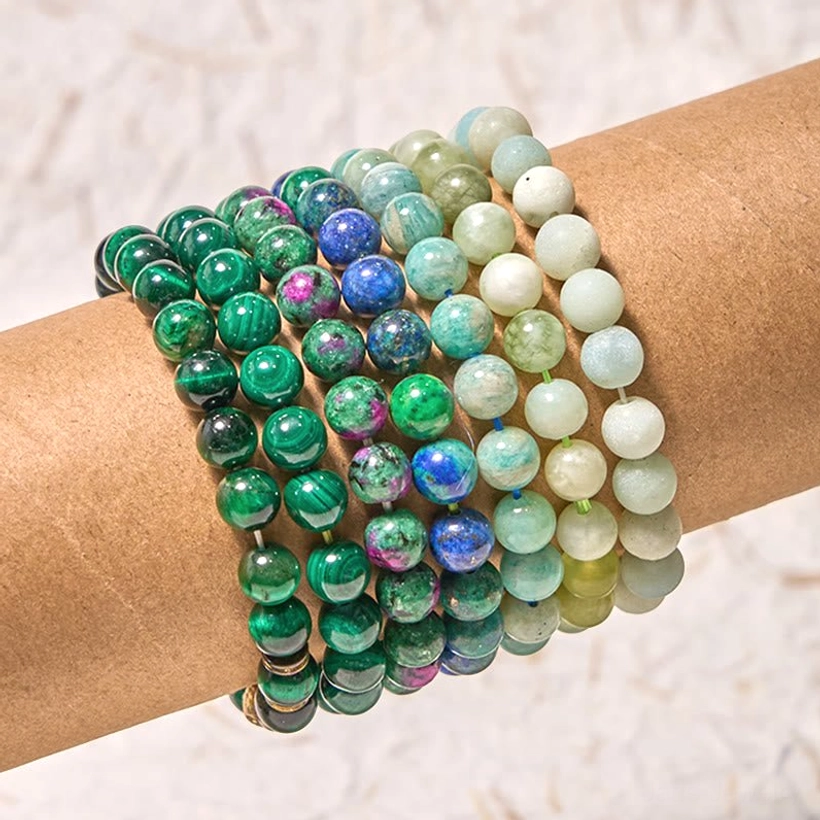 Green harmony jade amazonite balance bracelet worn on wrist, close-up side view showing mixed gemstone beads in green, blue, and earth tones