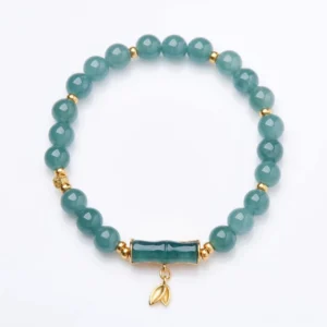 Natural green jade bamboo bracelet with gold-plated silver spacers displayed on white background, showcasing full beaded chain and ornamental bamboo charm