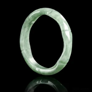 Authentic jade bamboo ring front view featuring light green natural stone and artistic bamboo design carved into band