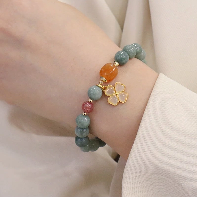 Oil-green jade beaded bracelet side profile showing round beads and charm details
