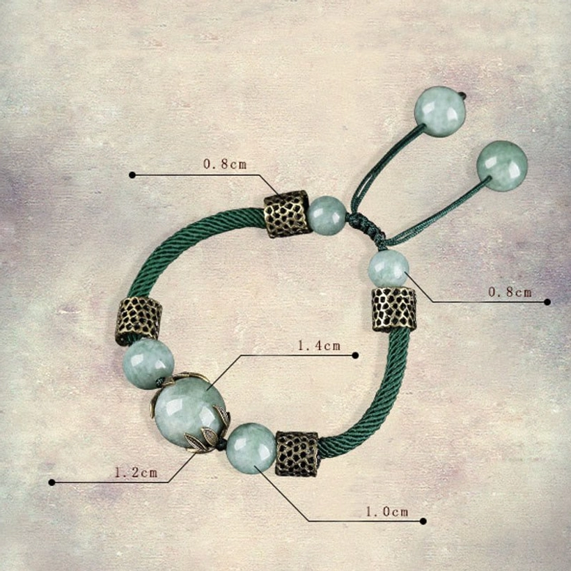 Green jade prosperity bracelet flat lay with size measurement labels showing adjustable pull-tie closure