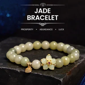 Green jade prosperity bracelet with Fu character charm - flat lay on dark starry display platform showing light green jade beads and gold flower accent