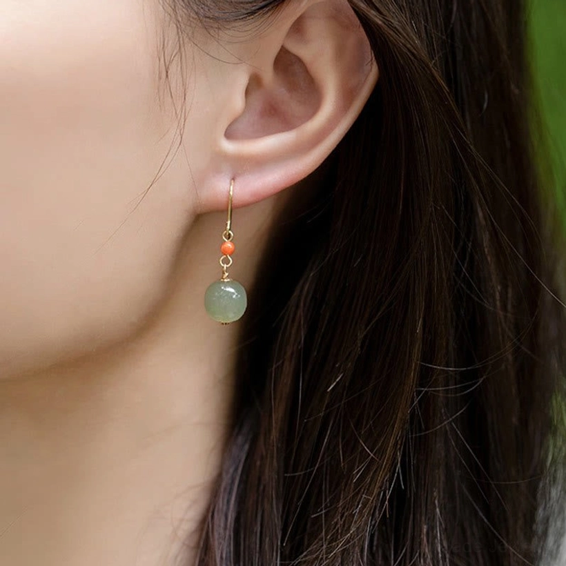 Green jade and red agate drop earrings with 14K plated gold hardware showing fine craftsmanship detail