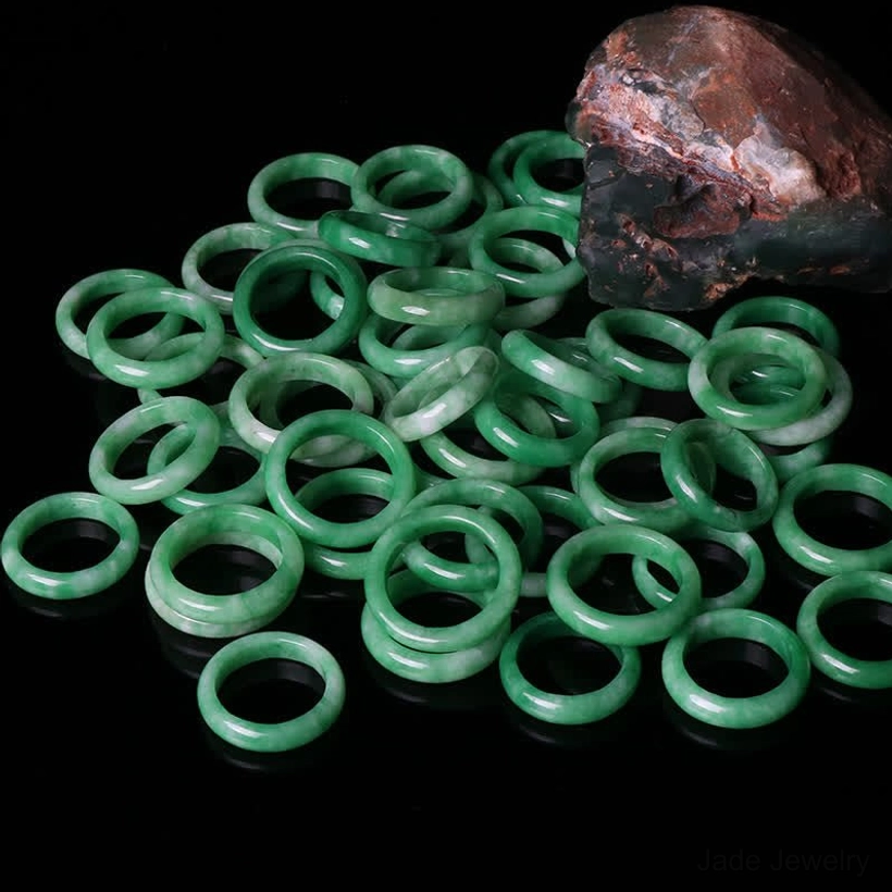 Bulk handcrafted jade prosperity rings uniform circular bands flat lay collection