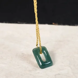 Natural green jade hollow square pendant on gold-plated twisted chain, angled side view showing pendant detail