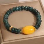 Green jade topaz prosperity bracelet with gold spacers - main product view in luxury gift box