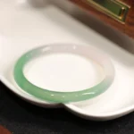 Natural green and white chalcedony agate cuff bangle bracelet with polished finish and gradient color