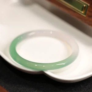 Natural green and white chalcedony agate cuff bangle bracelet with polished finish and gradient color