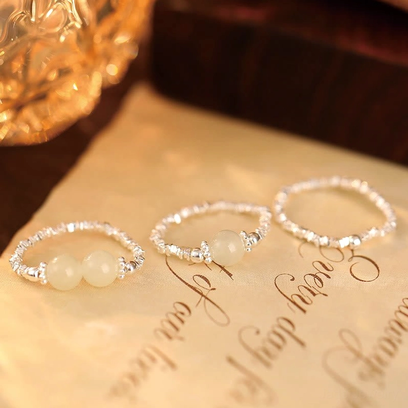 Handcrafted Hetian jade beaded elastic ring with natural stone variations and silver accents