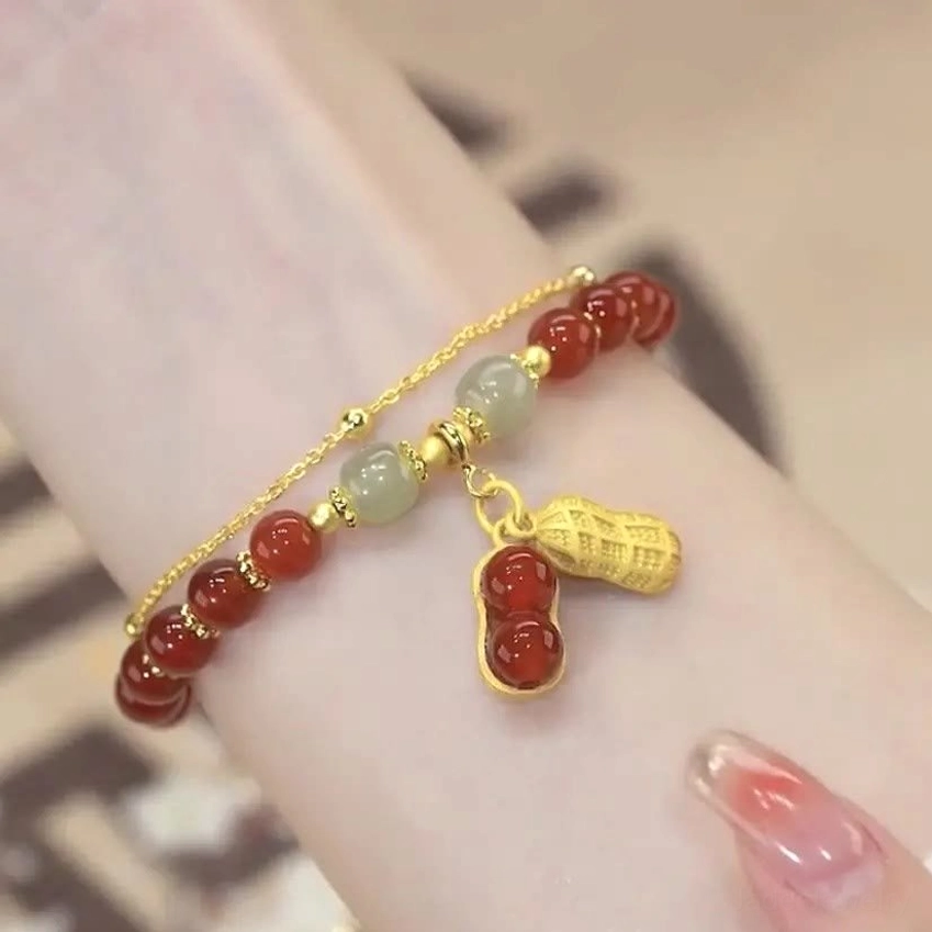 Handcrafted jade beaded bracelet artisan detail showing natural stone color variations