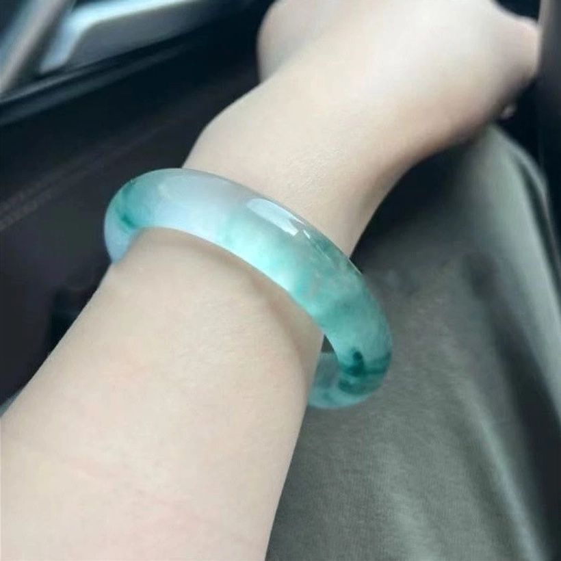 Authentic handmade jade bangle with floating flower design, premium natural stone quality