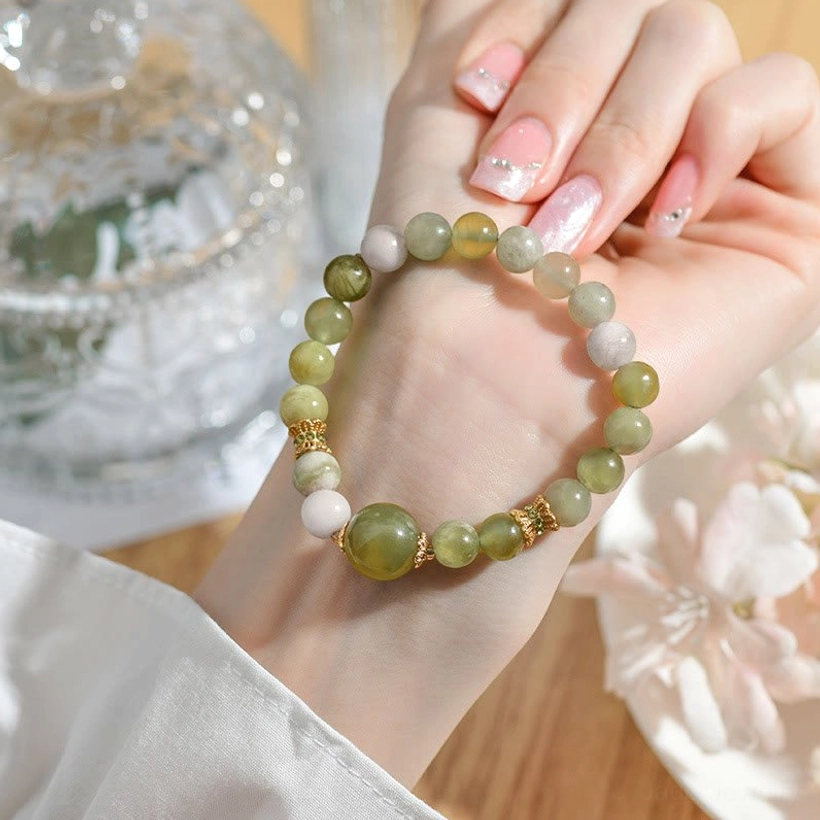 Handmade natural green jade abundance bracelet highlighting artisan craftsmanship