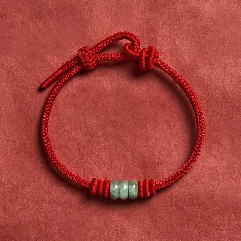 Authentic handmade red string jade protection bracelet showcasing traditional braided cord craftsmanship and natural jade beads