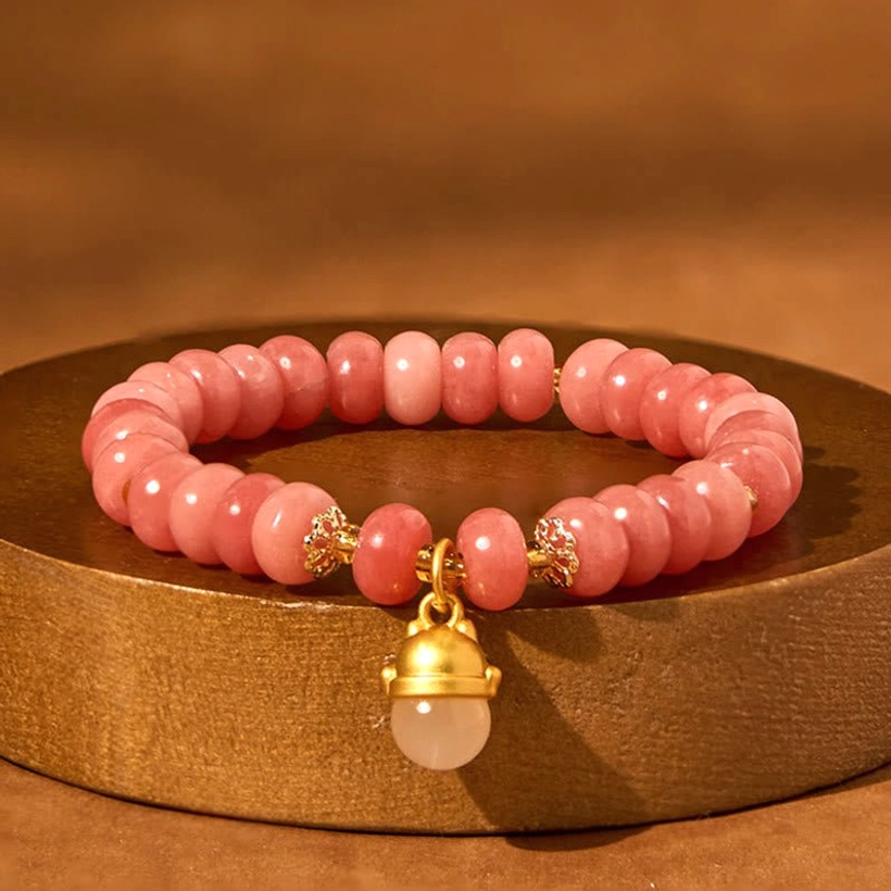Pink Healing Crystal Bracelet with Gold Lucky Cat Accent - Displayed on Wooden Round Tray