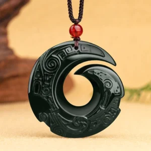 Intricate spiral carving details on polished dark cyan jade pendant with close-up studio lighting