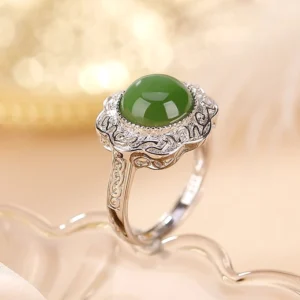 Hetian Cyan Jade Flower Ring in 925 Sterling Silver - 45-degree side view showcasing filigree silver setting and polished green jade stone