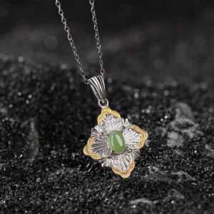 Hetian cyan jade rhombus pendant necklace with 925 sterling silver and gold plating, top-down view on black background