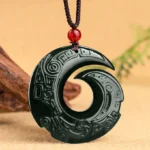 Hetian cyan jade spiral pendant necklace front hanging view with traditional braided red cord and wooden studio backdrop