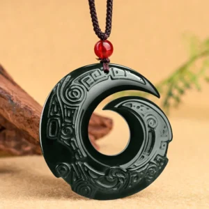 Hetian cyan jade spiral pendant necklace front hanging view with traditional braided red cord and wooden studio backdrop