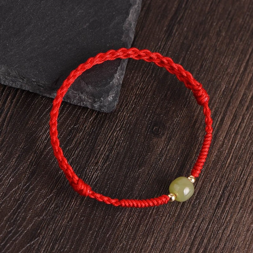Hetian jade 14K gold beads bright red cord bracelet detail close-up