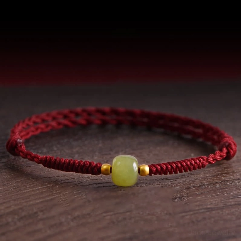 Hetian jade 999 gold beads red string protection bracelet overhead view