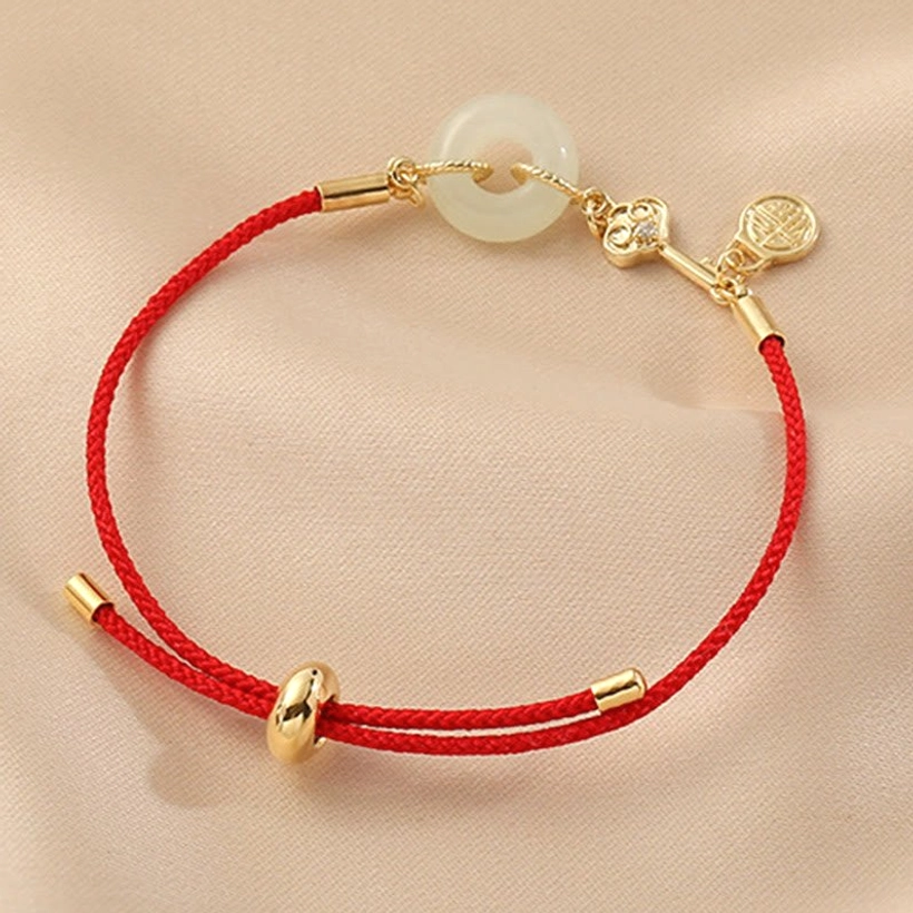 Adjustable red rope jade bracelet demonstrating flexible sizing from 14-22cm wrist circumference