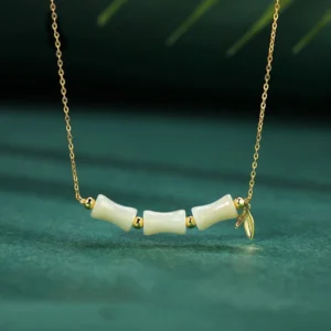 Hetian jade bamboo fu character necklace 925 sterling silver front view dark green background