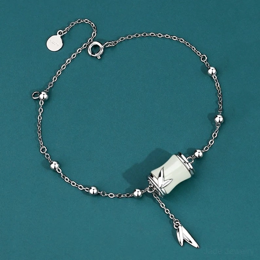 925 Sterling silver beaded bracelet with Hetian white jade bamboo charm, adjustable clasp, and leaf tassel pendant, handcrafted for protection and prosperity
